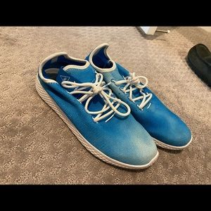 Men’s Adidas Pharrell Williams sneakers.